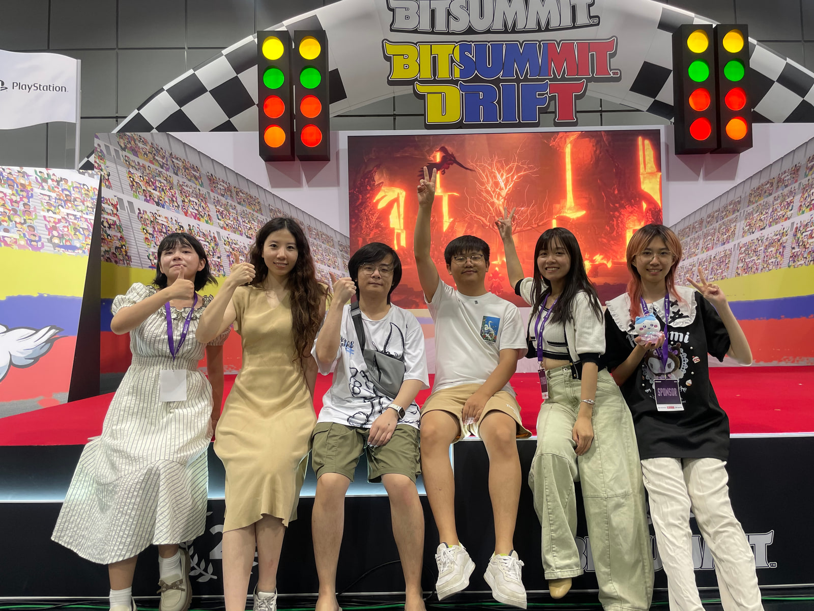 Team photograph at a BitSummit booth in Kyoto